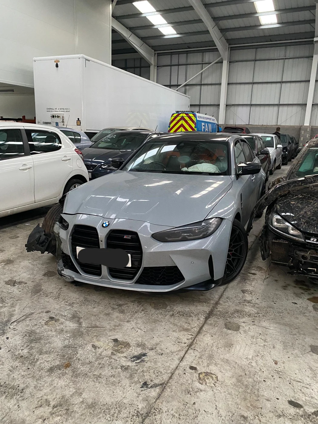Silver BMW inside the AE Collision Center workshop